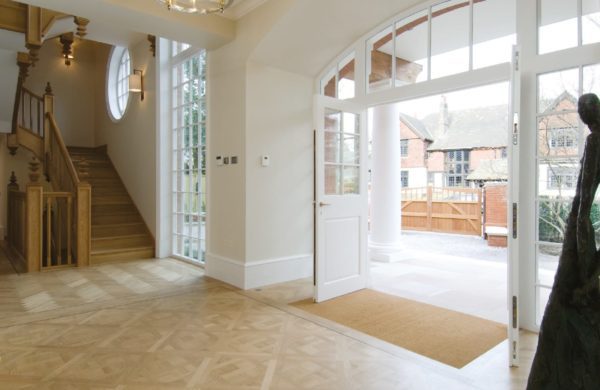 beautiful grange road entrance showing stunning timber doors and staircase