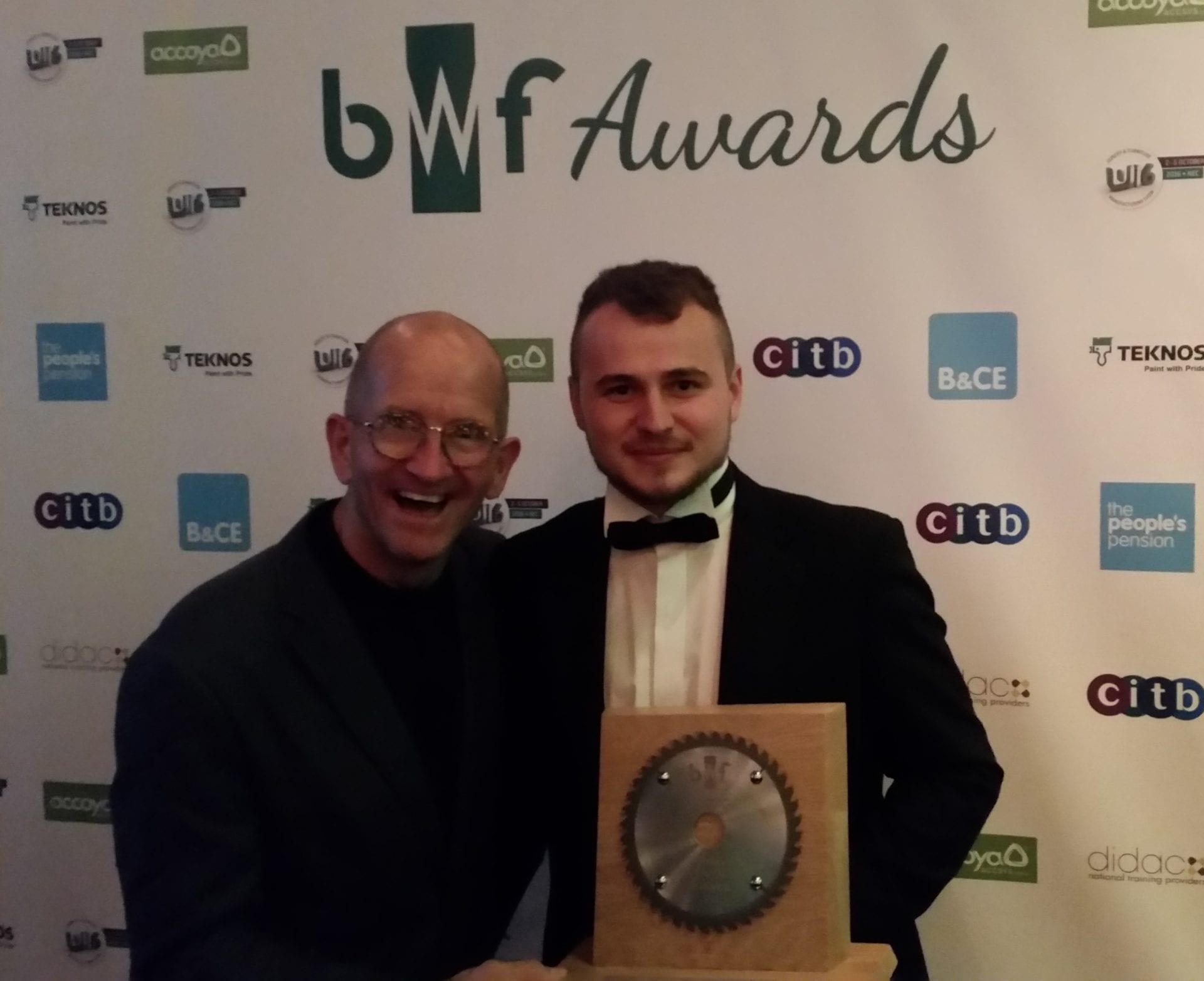 Greg receives his award from the BWF
