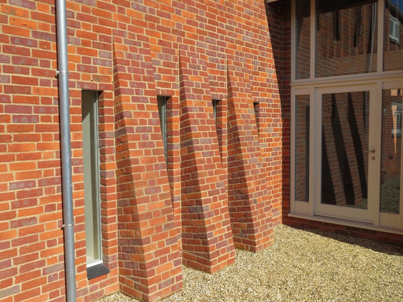 Direct glazed hardwick windows hidden in reveal brickwork red brick