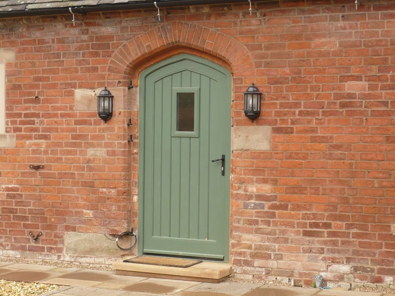 Gothic arched Melbourne door vision panel booth painted brick stone cill barn conversion