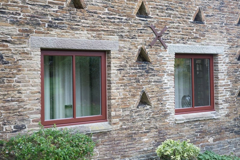 casement windows in stone setting