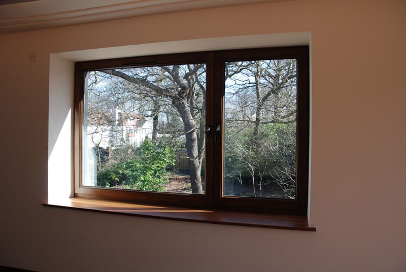 Hardwood Kedleston tilt and turn window dark stained idigbo double casement