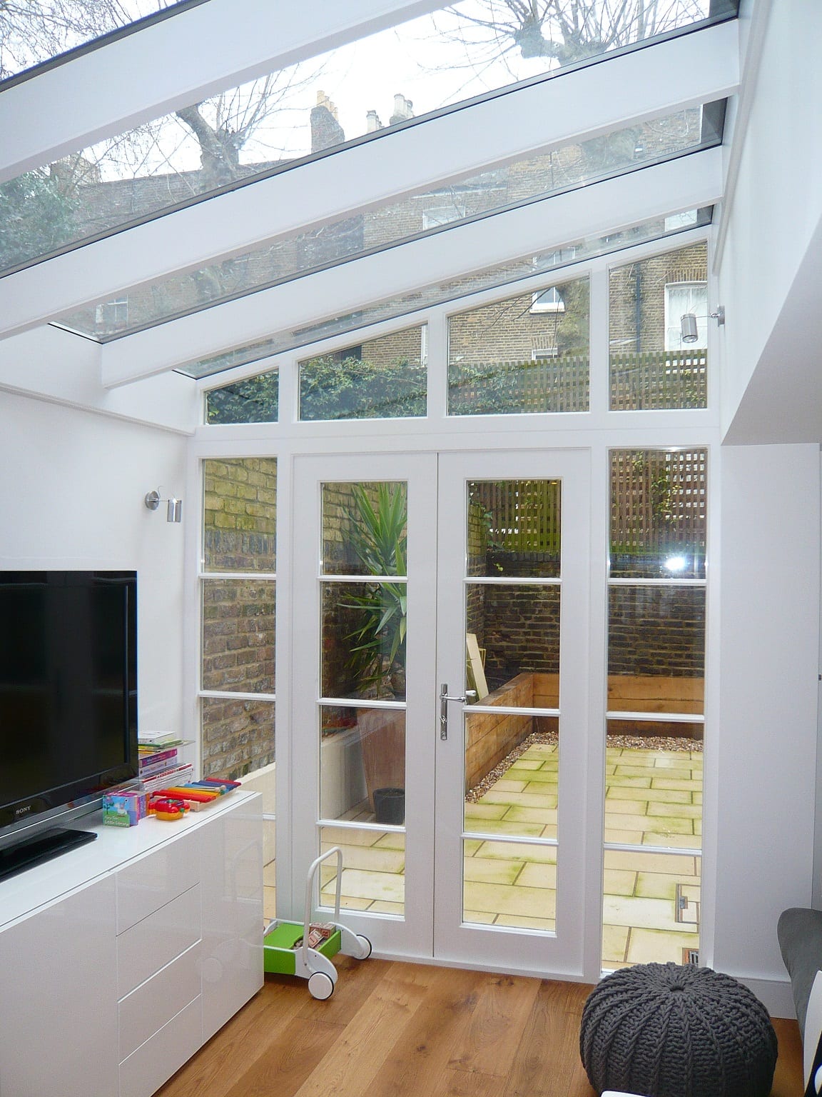 Internal view lean to conservatory angled screen french doors white