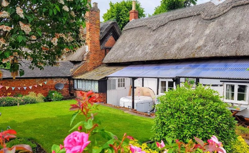 Richmond casement windows in thatched cottage teachers lodgings part of Repton School in Derby