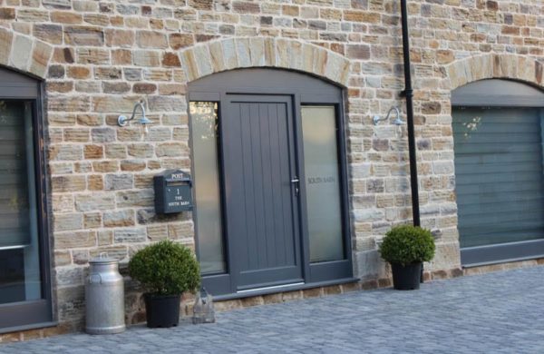 One of the front doors for barn conversions with radial scribe top at Dunston Barn Conversion
