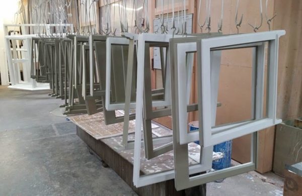 Heritage windows waiting for finishing in the paint department
