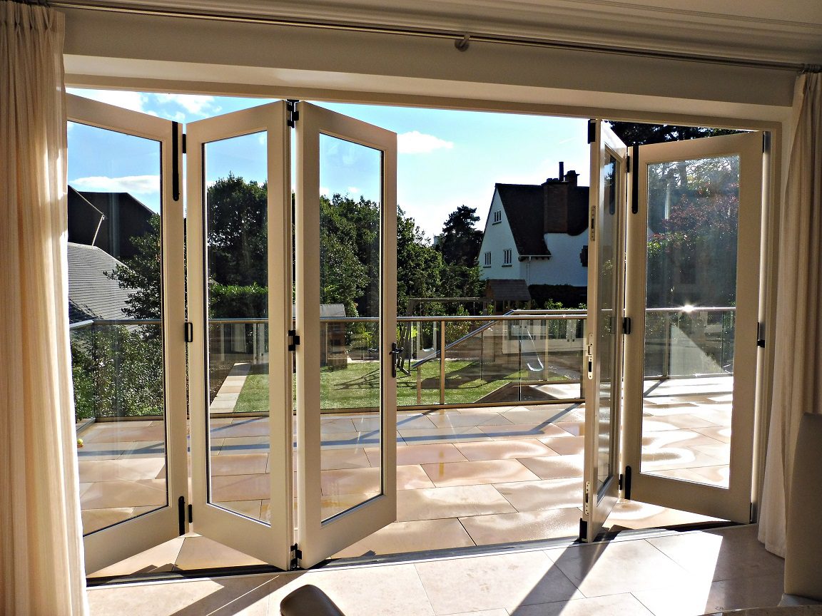 brilliant use of bifold door opening up a room to a large patio area
