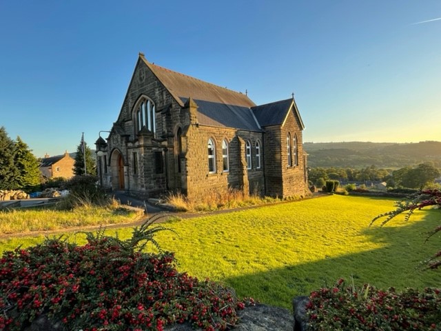 Converted gritstone church featuring gothic arch casement timber windows from Gowercroft Joinery.