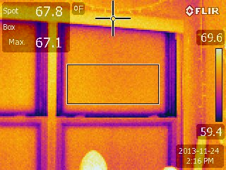 Thermal imaging shows heat lost around the edges of a window pane, also known as a thermal bridge.