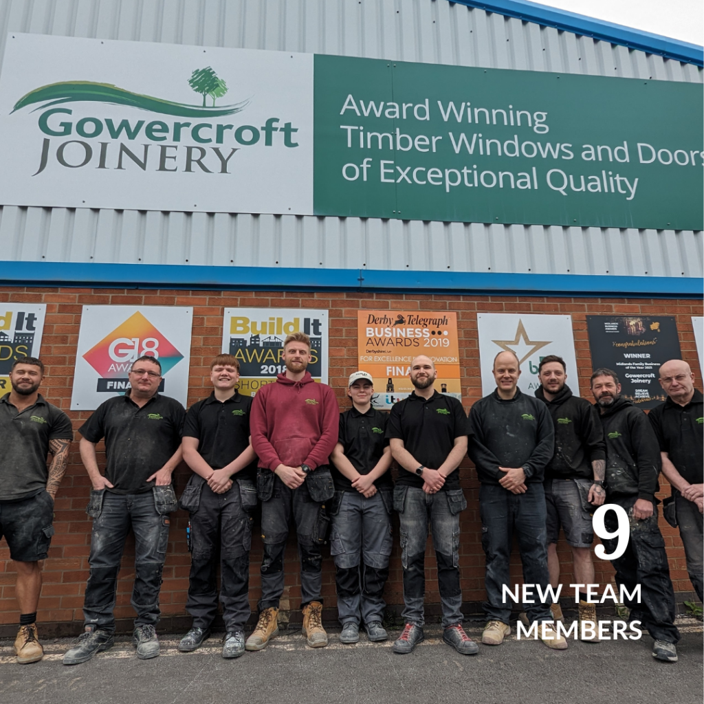 The Gowercroft Joinery team, standing in front of the company building under the signage showcasing awards.