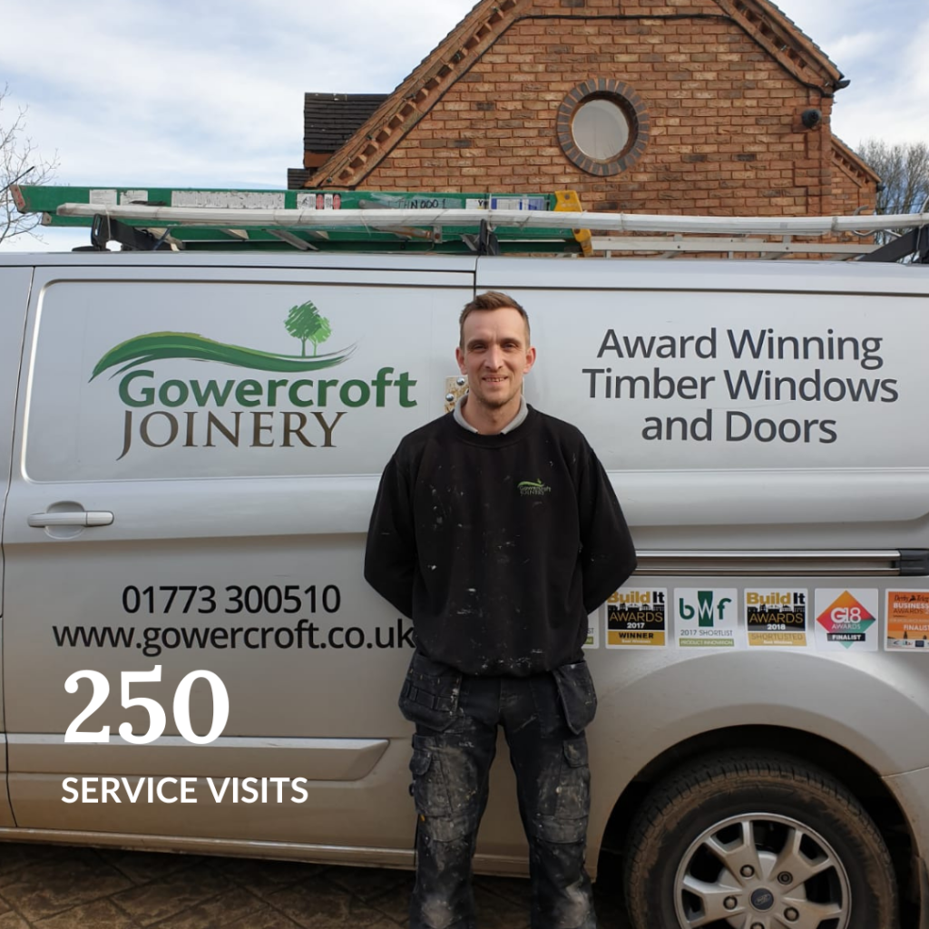 Gowercroft Joinery team member standing in front of a branded service van, showcasing commitment to 250 service visits completed in 2024.